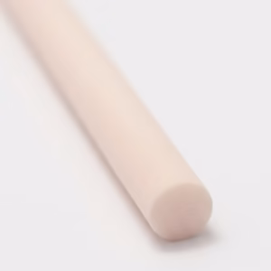 Single beige fibre diffuser reed stick on a clean white surface.